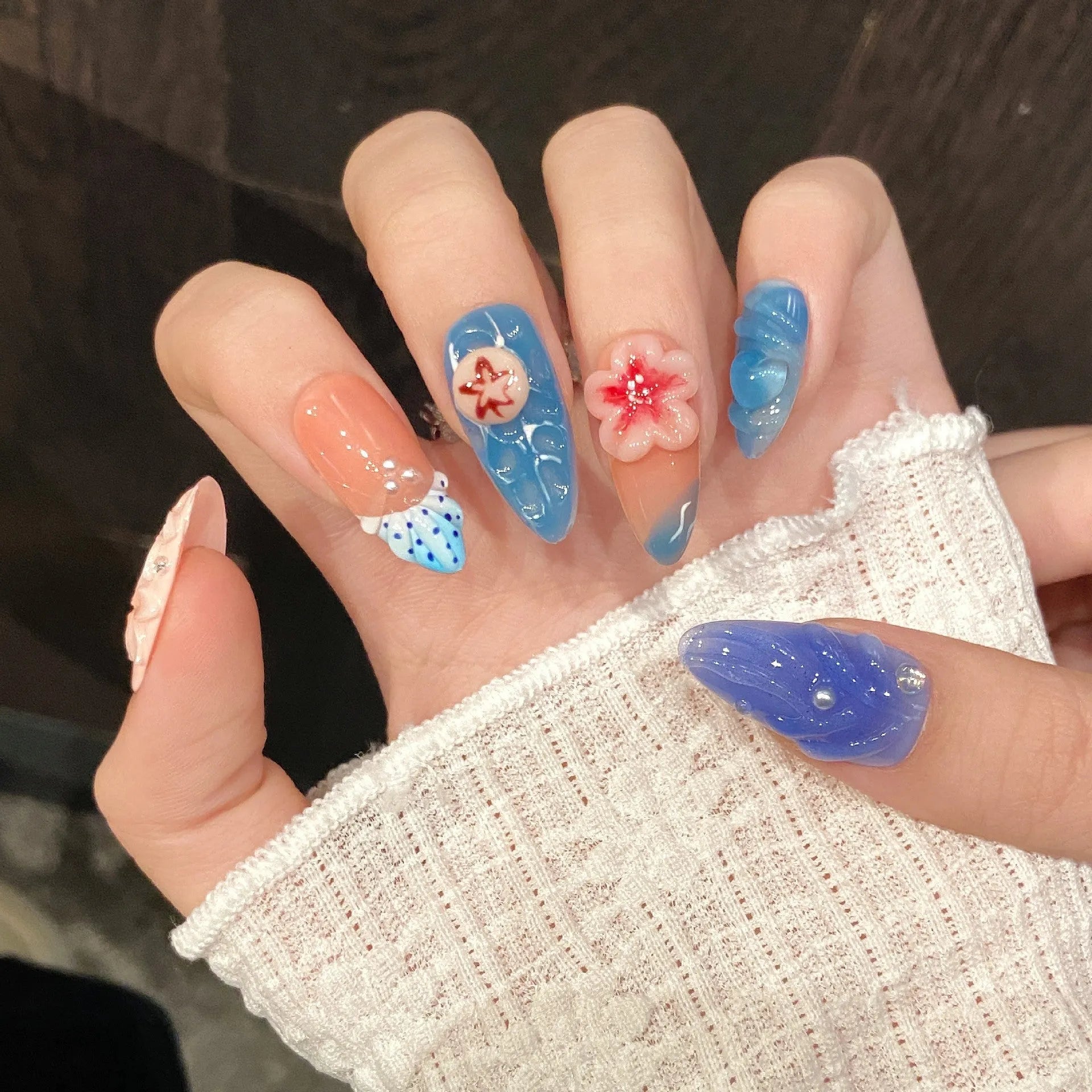 Plastic wearable armour with three-dimensional carved jellyfish marine design in almond nail colour