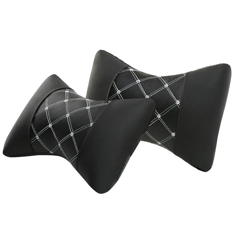 Black quilted artificial leather car headrest pillow with contrast stitching for neck support.