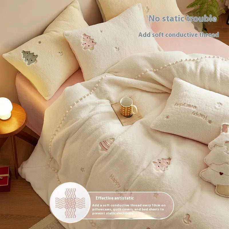 Milk fibre four-piece bed linen set with green Christmas tree pattern on a quilt cover and pillowcase.