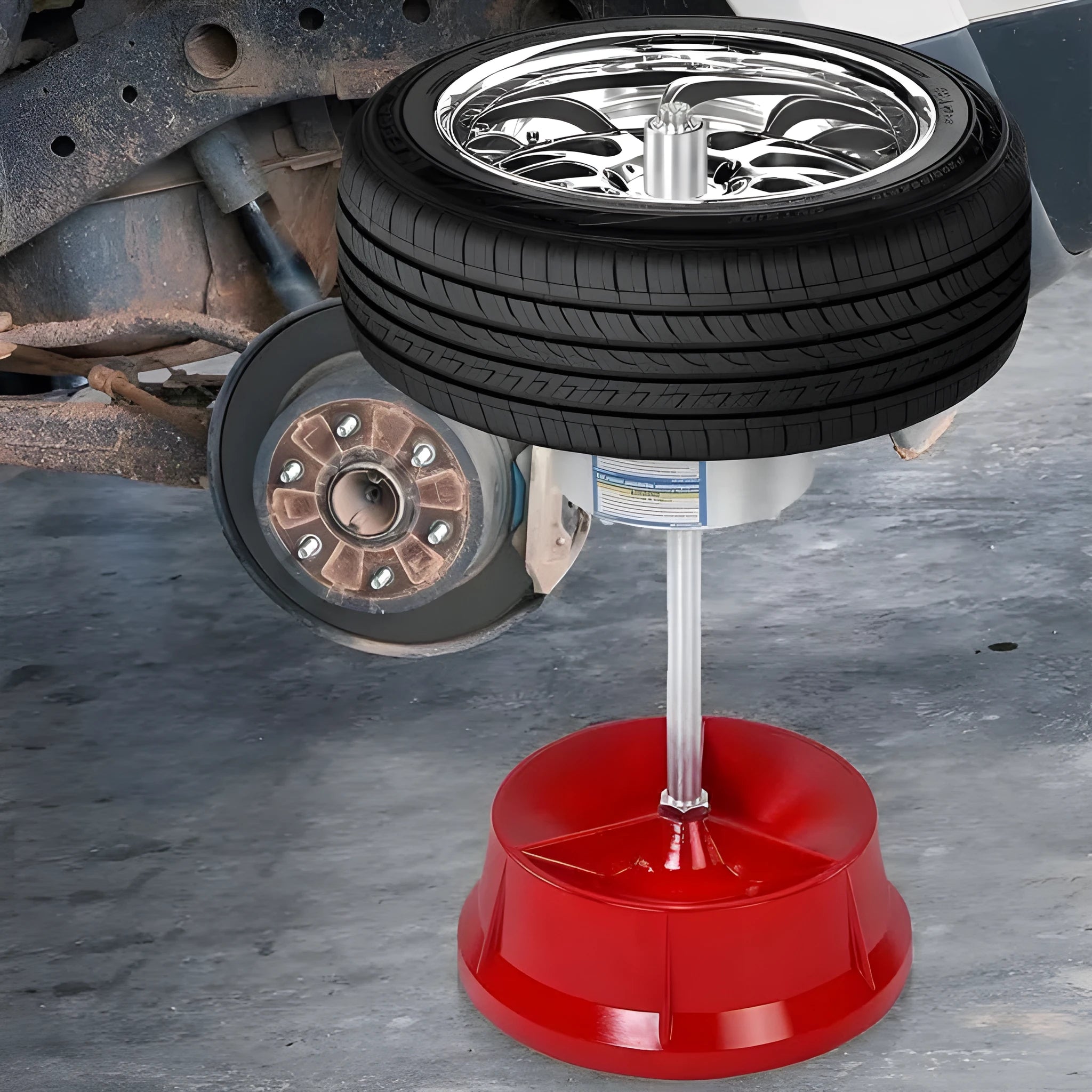 Portable aluminium hub balancer with enamel base for wheel balancing.