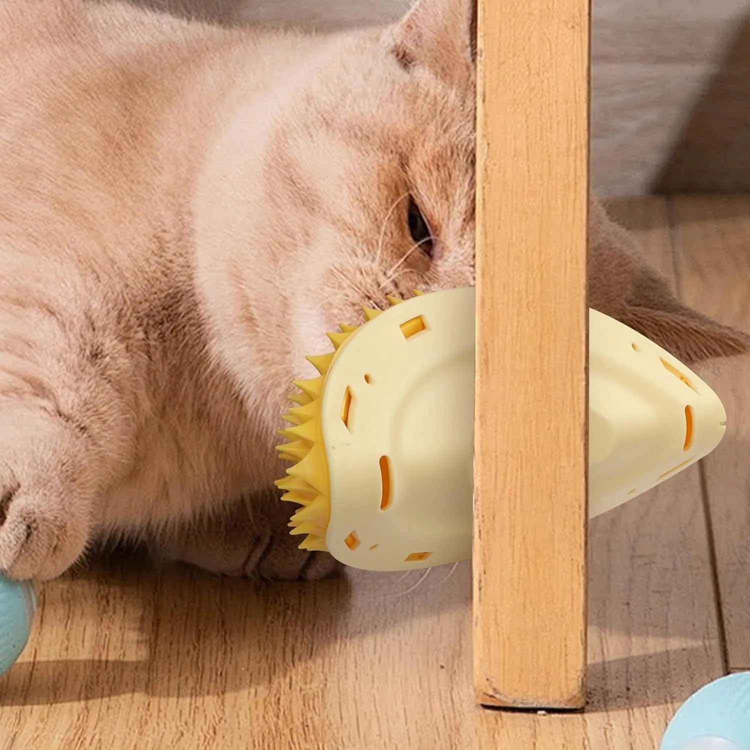 Yellow durian-shaped cat corner scratcher and grooming comb with adhesive backing