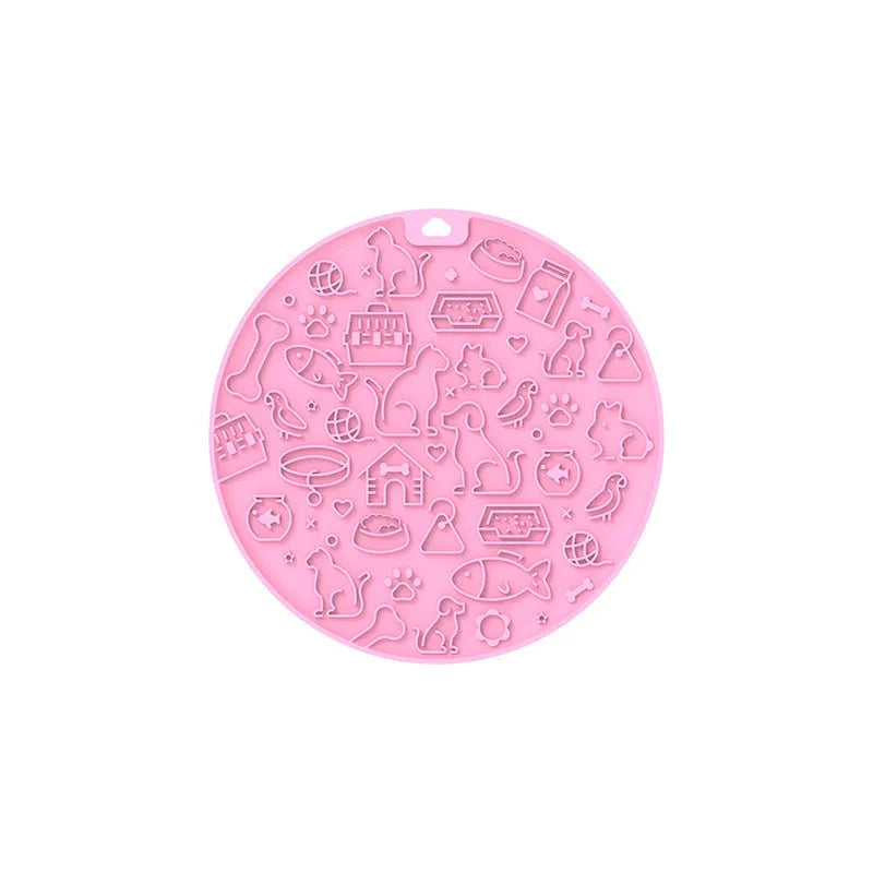 Round silicone pet licking mat with suction cup base in blue colour on a floor.