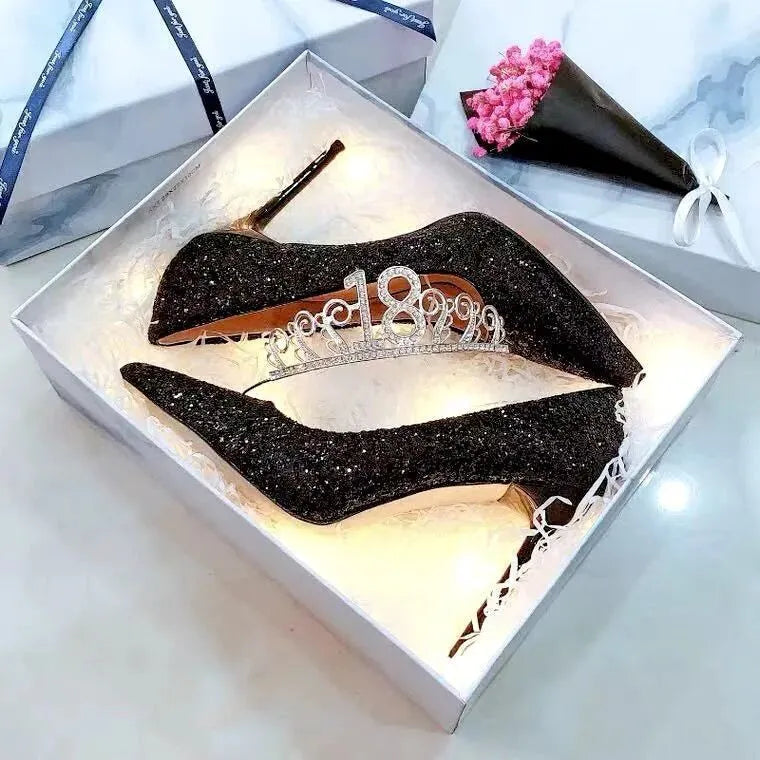 Silver and black women's stiletto bridal shoes with crystal decoration, showing different heel heights.