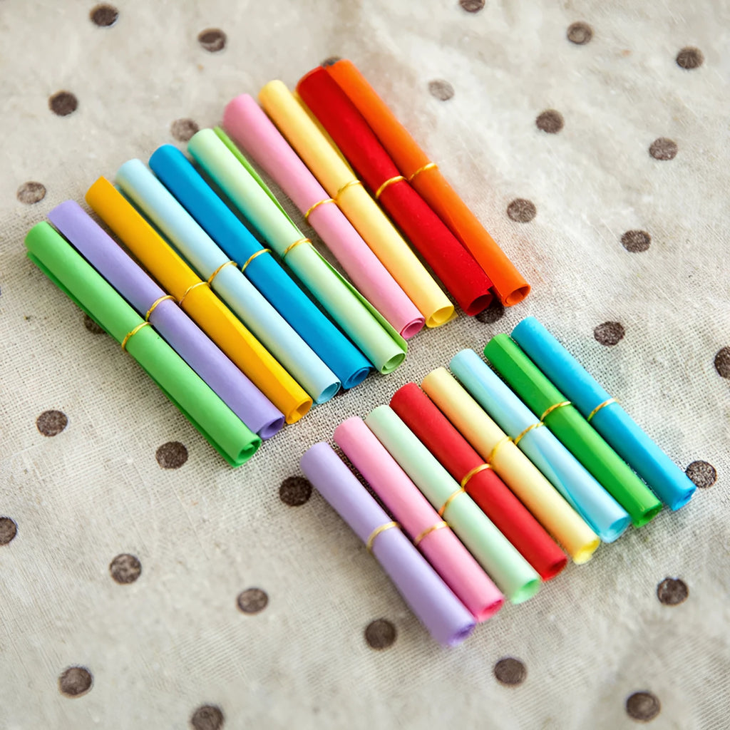 Multi-coloured mini paper scrolls with metal eyelets in 3x7cm, 4x7cm, 5x5cm, and 7x7cm sizes for drift bottle messages