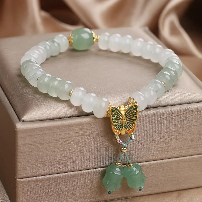 Green crystal women's bracelet with Tian Shan Cui abacus beads and retro butterfly tassel design measuring 17 cm