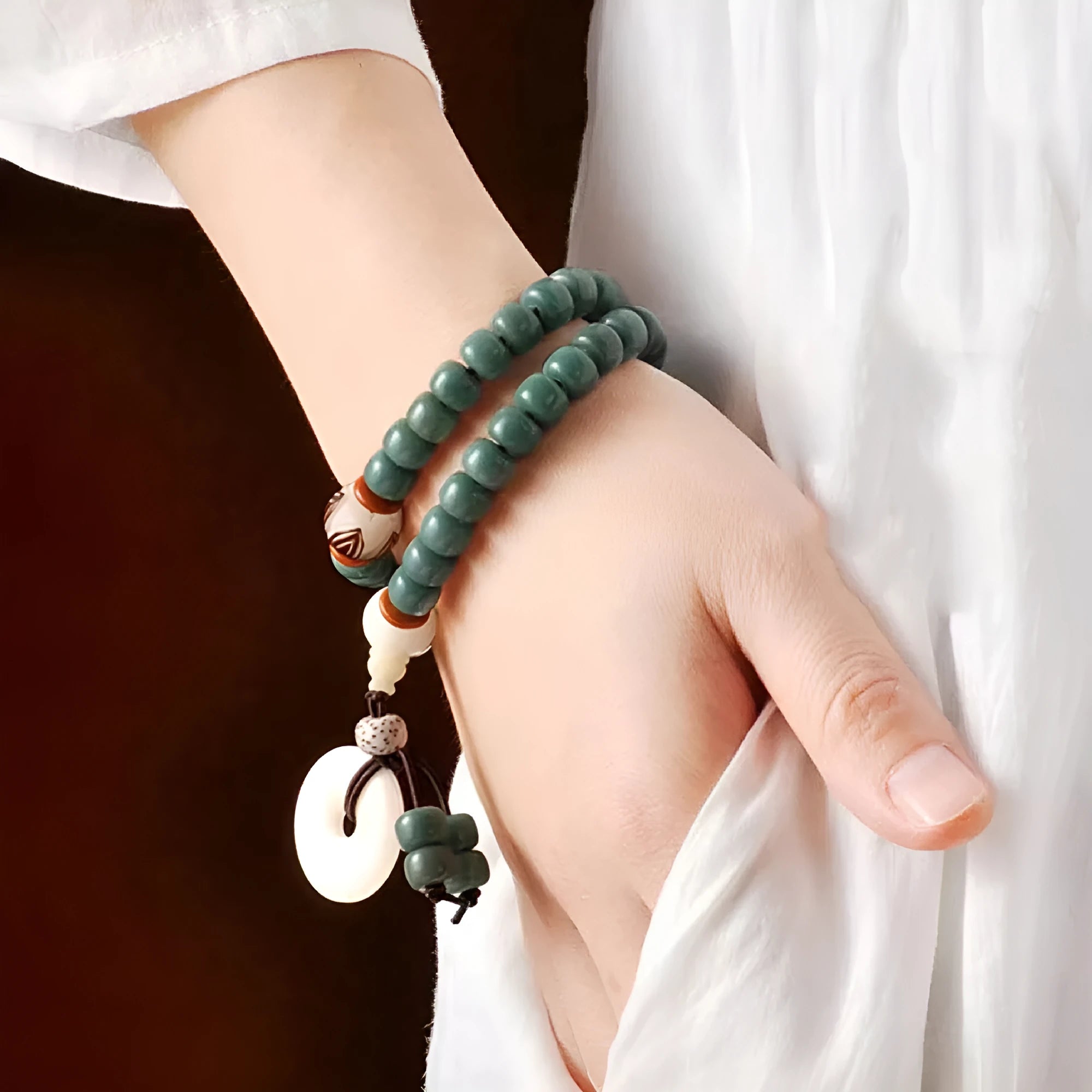 White Jade Bodhi Green Sandalwood Bracelet with Bodhi seed beads, lotus charms, and a double ring safety clasp.