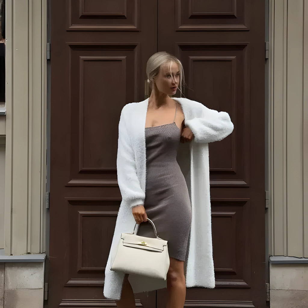 White women's longline cardigan jacket with long sleeves, loose fit.