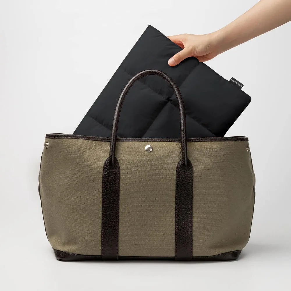 Soft fluffy polyester laptop sleeve for 13-15.6 inch devices in black or khaki with visible sewing thread