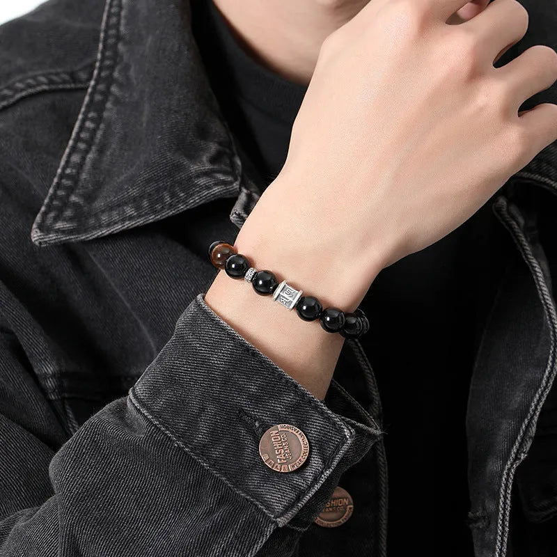 Men's obsidian and pure silver bracelet with a 10mm mantra prayer wheel bead.