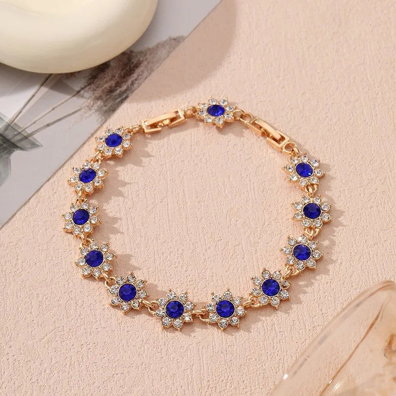 Floral-shaped zinc alloy bracelet with electroplated finish in gold and silver colour options.