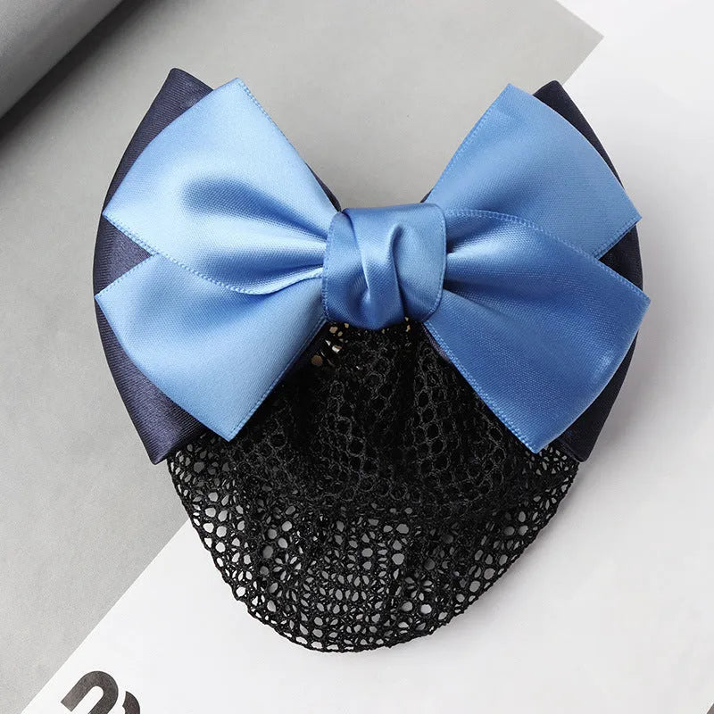Professional hair clip with a black net pocket and a red flower bow ornament on a white background.
