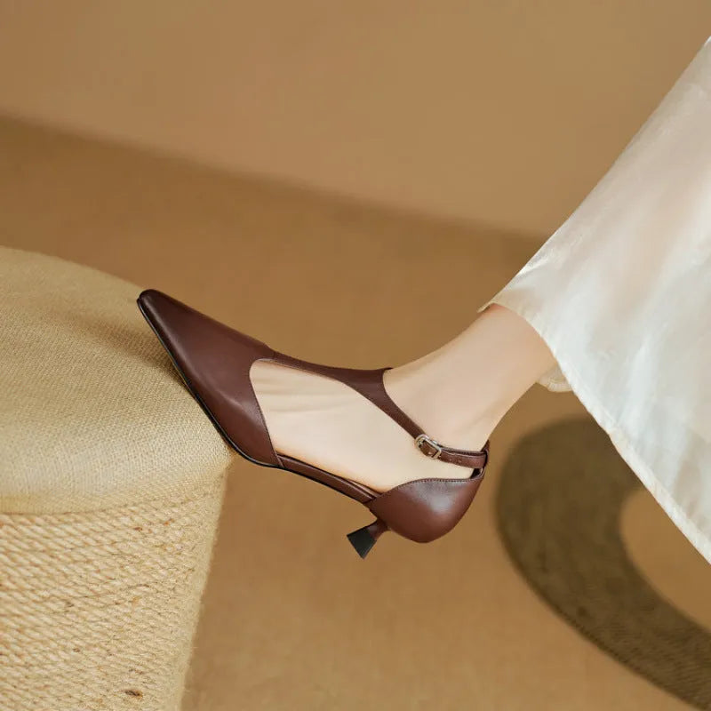 Women's black pointed toe high heels made from cowhide leather.