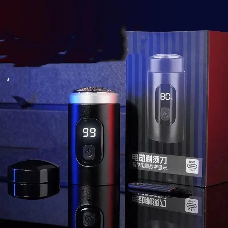 Black mini rechargeable shaver with USB cable and cleaning brush on a table