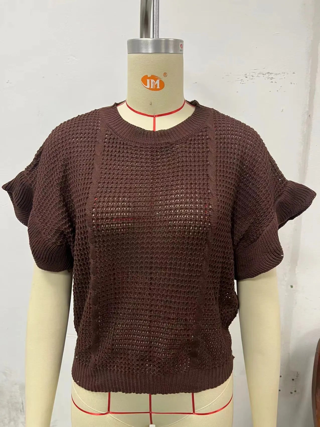 Women's loose fit knitted pullover with ruffled short sleeves and twisted string texture