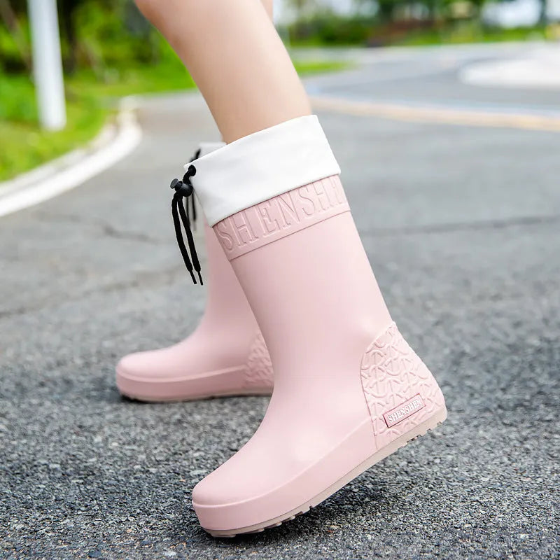 Women's PVC rain boots with non-slip soles in apricot, black, brown, or pink colours