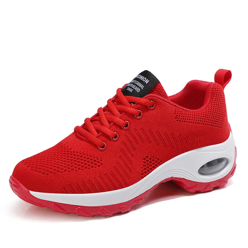 Women's red and black mesh sneakers with lace-up front and round toe design