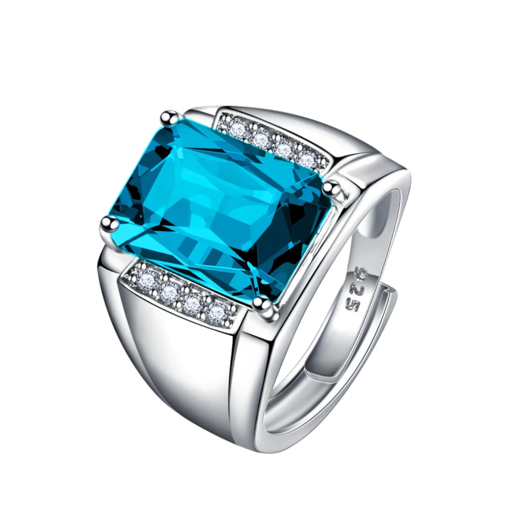 Adjustable open geometric ring with a coloured rhinestone on a copper band.