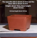 A square purple clay flower pot for succulents or bonsai plants on a tabletop.