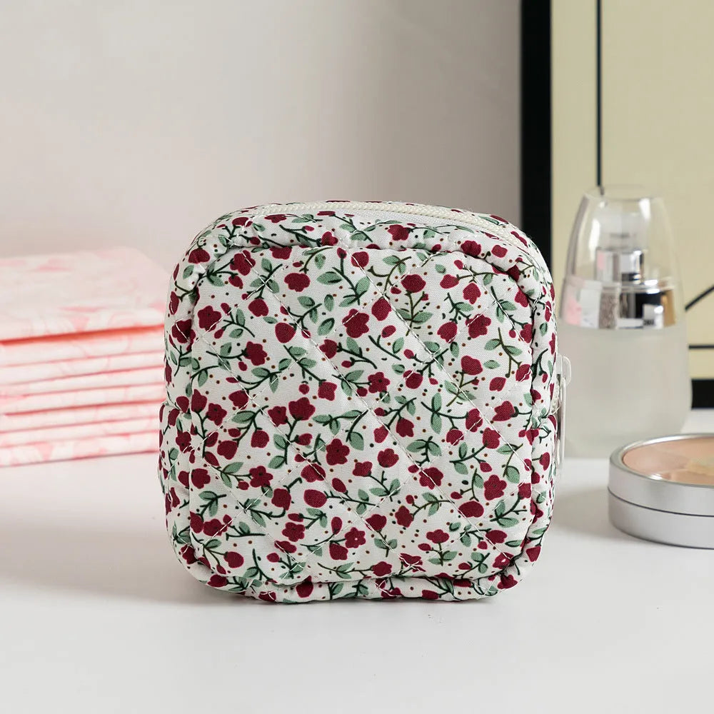 Floral polyester key storage bag with sewing thread detailing in multiple colour patterns