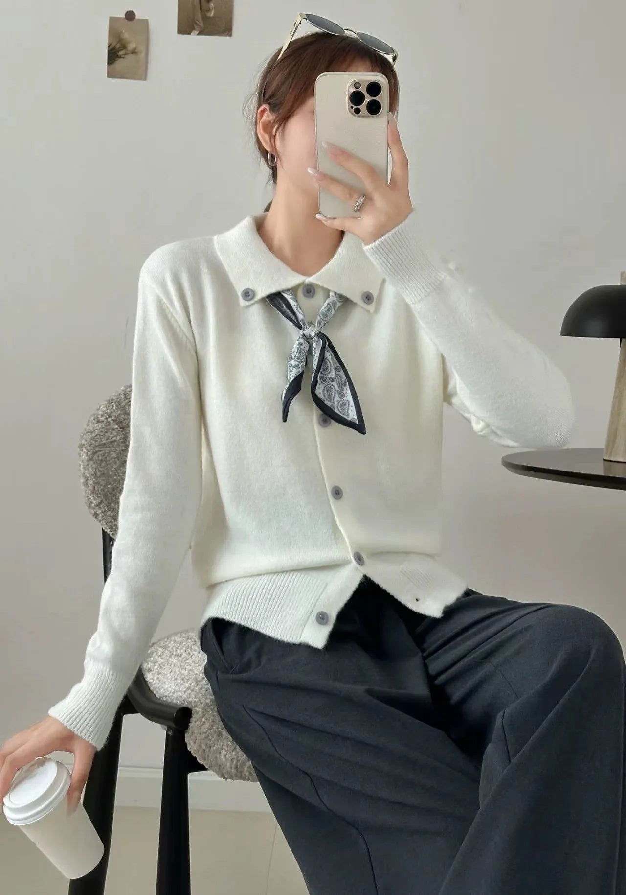 Beige lapel scarf cardigan sweater with long sleeves and splicing details on a model.