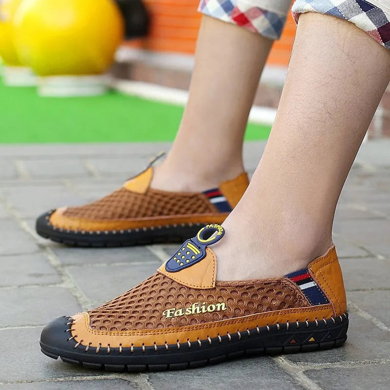 Men's brown breathable mesh casual shoes with round toe and rubber sole on a plain background.