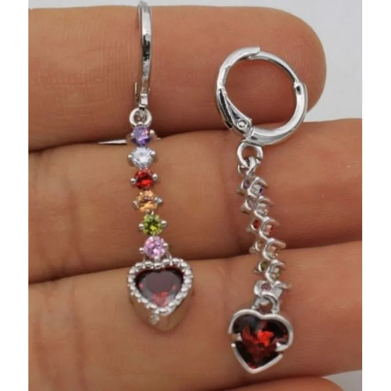 A pair of women's heart-shaped alloy earrings in gold or silver electroplated finish.