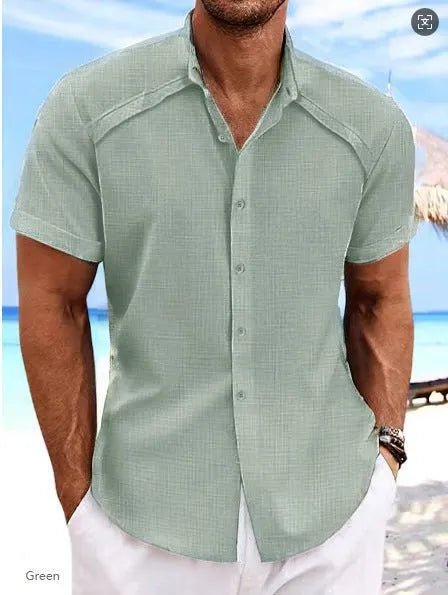 Hawaiian casual short sleeve solid colour shirt in a cotton blend fabric on a hanger.