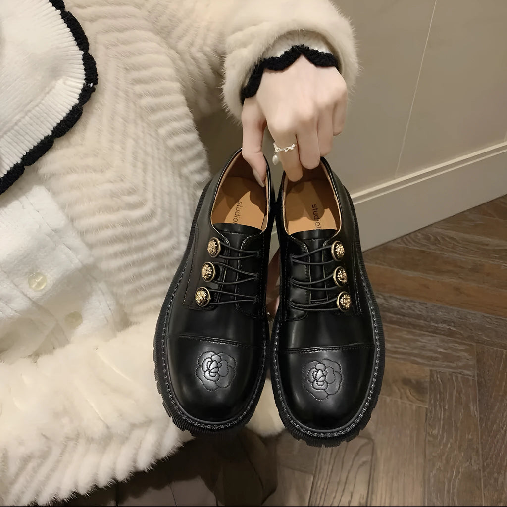 Glossy black block heel pumps with round toe and cowhide upper