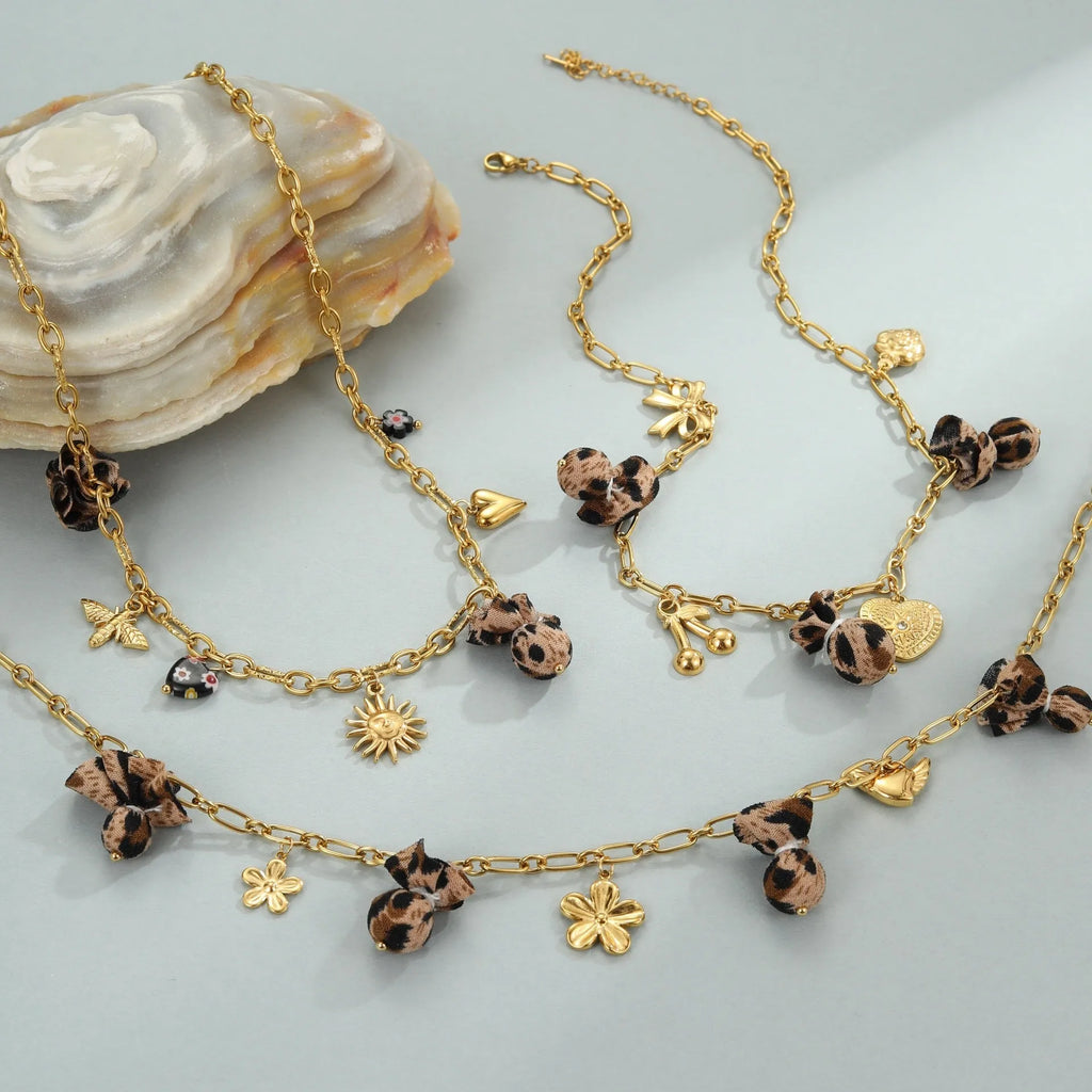 Stainless steel necklace with leopard print heart pendant featuring flower accents on adjustable 41-50cm chain