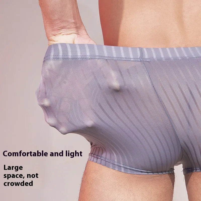 Men's striped underwear in thin transparent nylon fabric showing black, white, and dark grey colour options