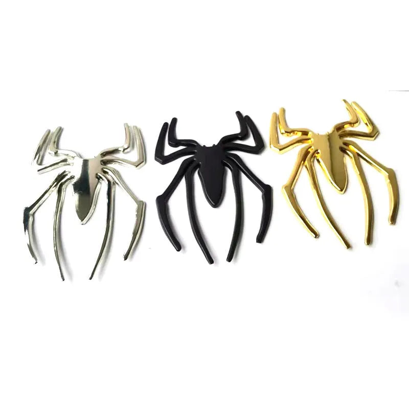 Three-dimensional metal spider sticker in gold colour, measuring 7cm by 5cm.