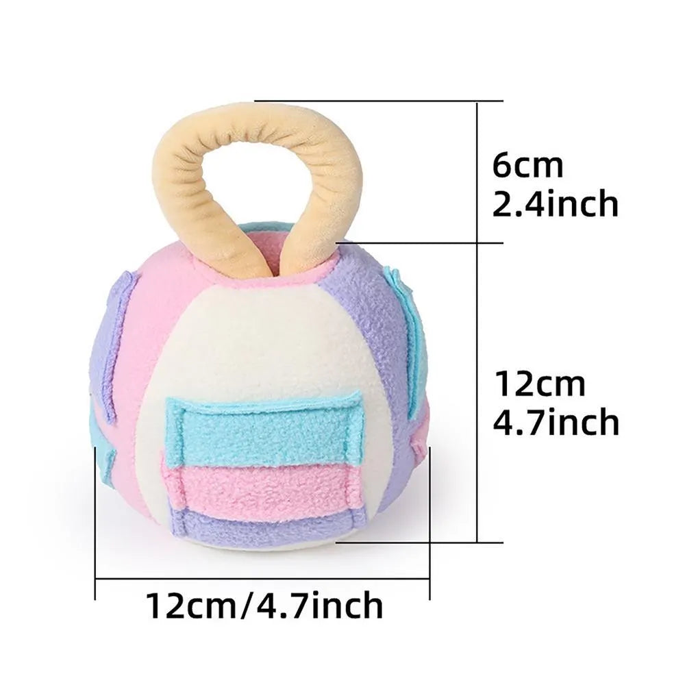 Green polyester squeaky plush ball dog toy with treat pockets on grass