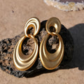 Quicksand gold coloured double circle French retro drop earrings with a U-shaped silhouette.