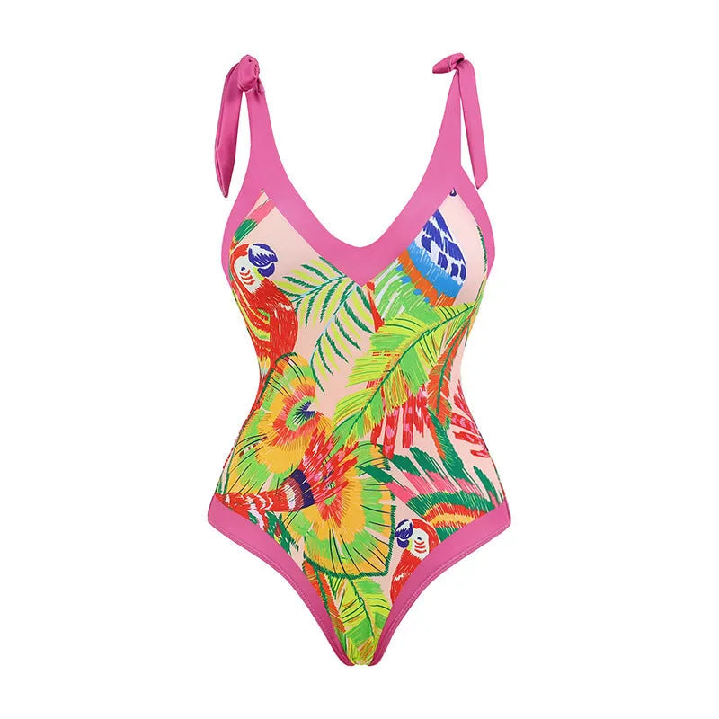 Pink floral print one-piece swimsuit with V-neck, covered belly, and an attached skirt.