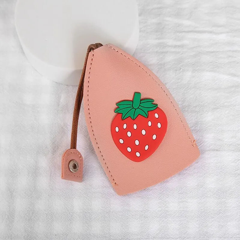 Cartoon pull-out key case in PU leather showing design options including resin fruit and big cartoon animal prints.