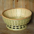 Handmade woven bamboo storage basket in natural colour with open top design