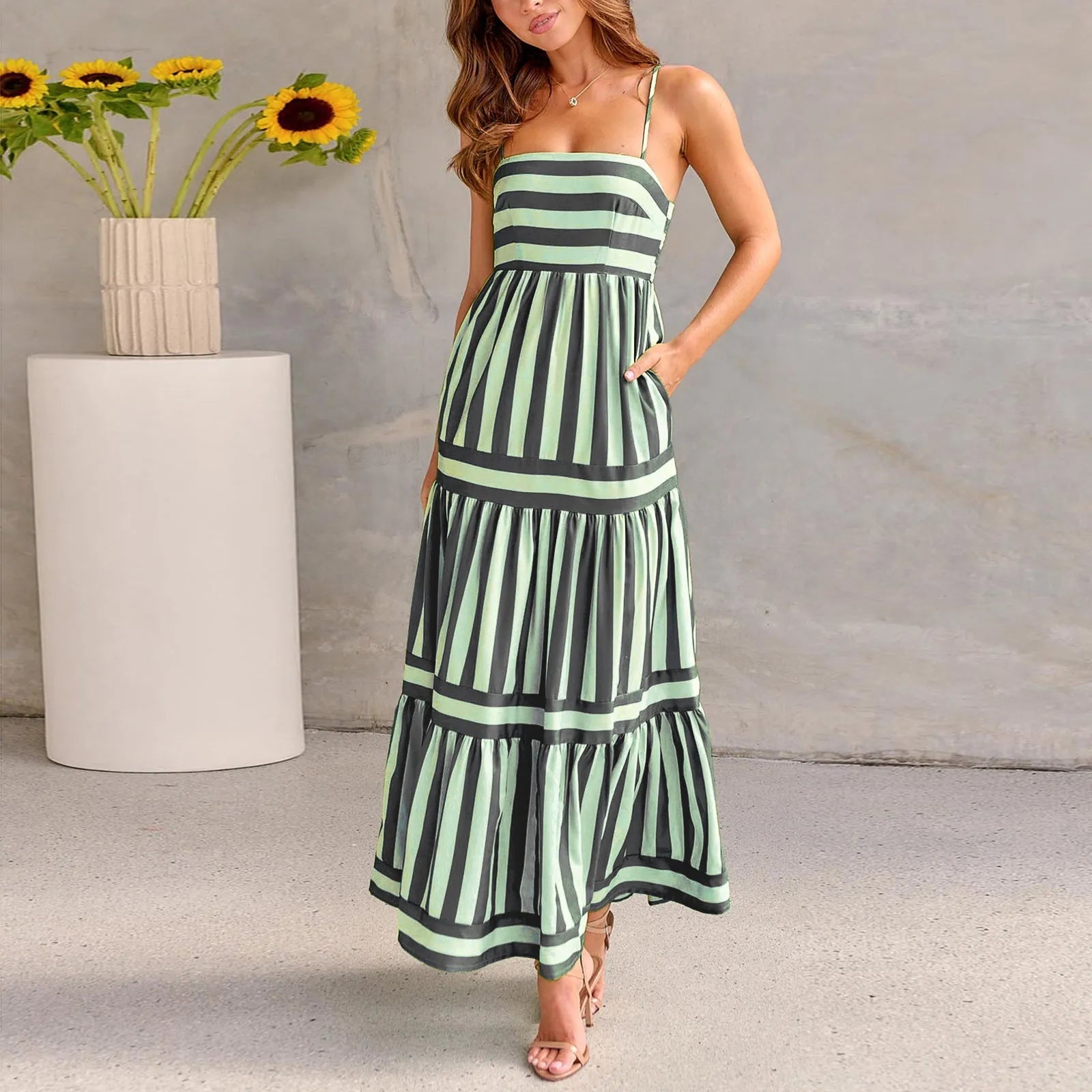 Women's long striped summer dress with suspenders, a square neckline, backless design, and side pockets.