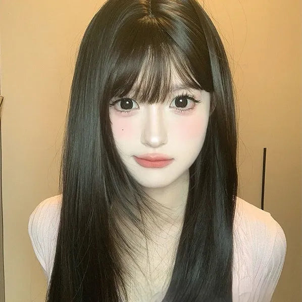 Dark brown long straight synthetic wig with a fringe on a wig head stand.