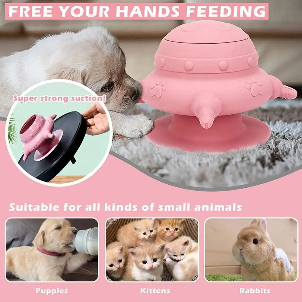 Pink silicone pet milk feeder with four nursing pacifiers and a lid on a flat base.