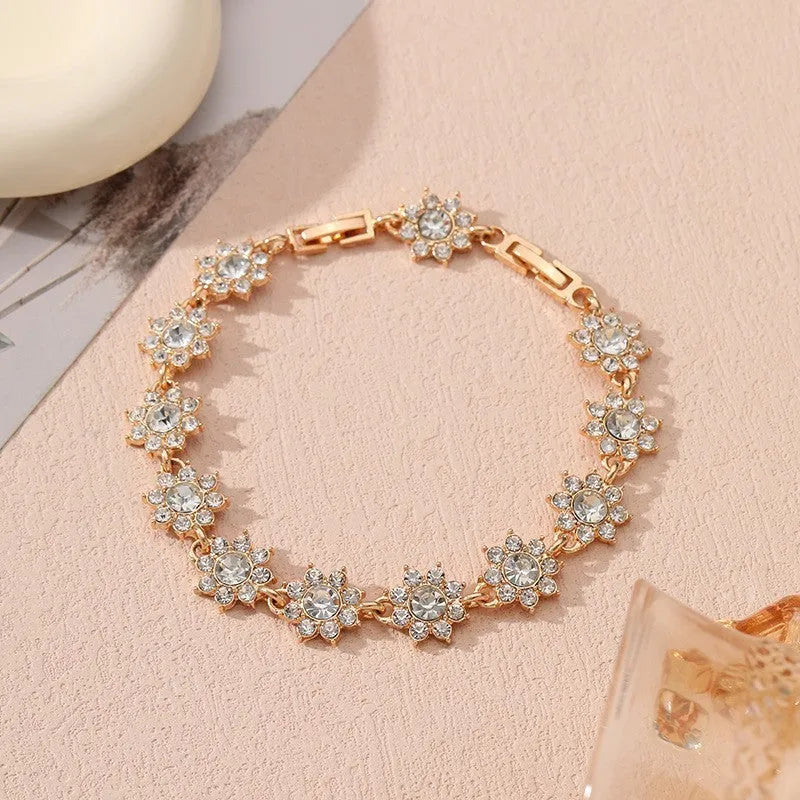 Floral-shaped zinc alloy bracelet with electroplated finish in gold and silver colour options.