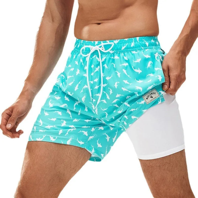 Men's loose swimming trunks with elastic waistband in multiple colour patterns including floral and aquatic designs