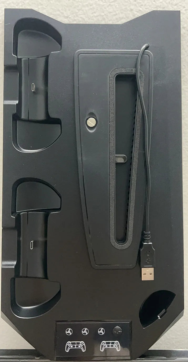 White PS5 charging stand with console upright, DualSense handle docked, and headset on hook.