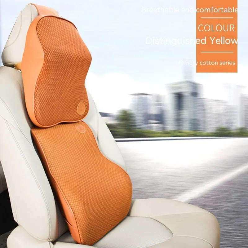 Black and brown memory foam car headrest pillow and lumbar support cushion set on a car seat.