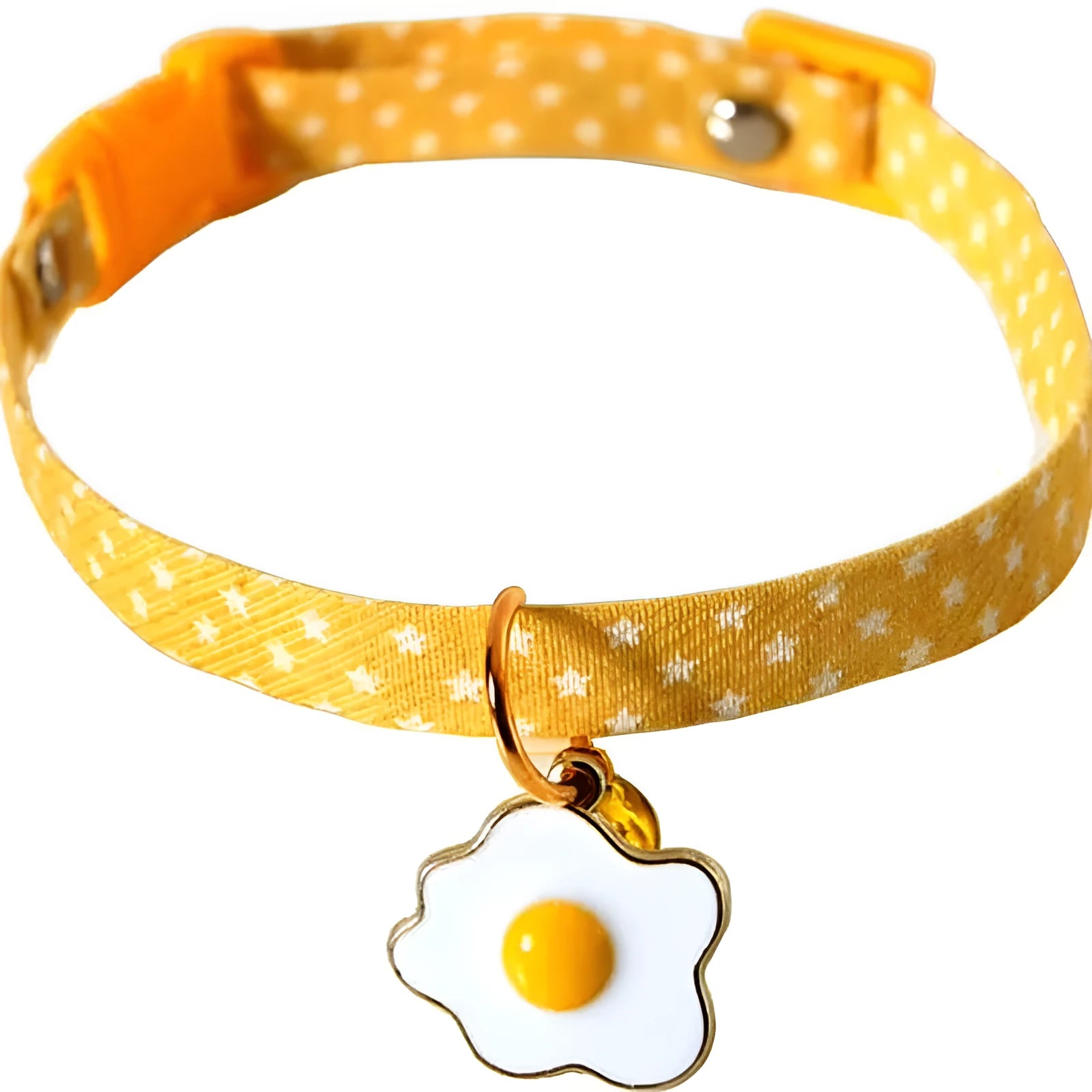 Green adjustable cat collar with a metal bell and pink bow tie on a small dog