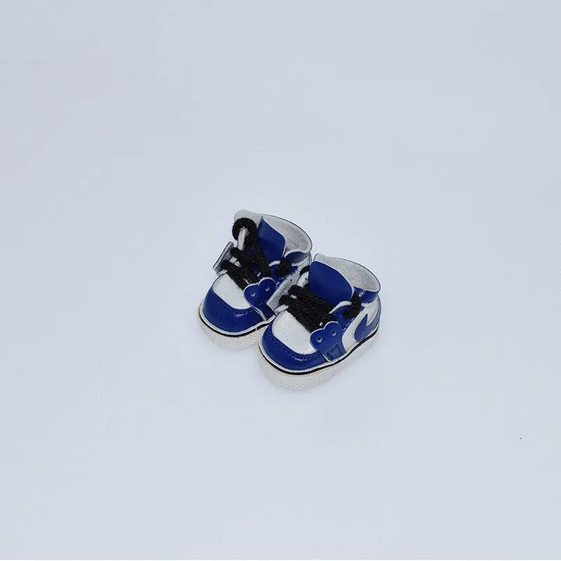 Set of miniature doll replacement shoes in various styles and colours for 17cm scale figures.