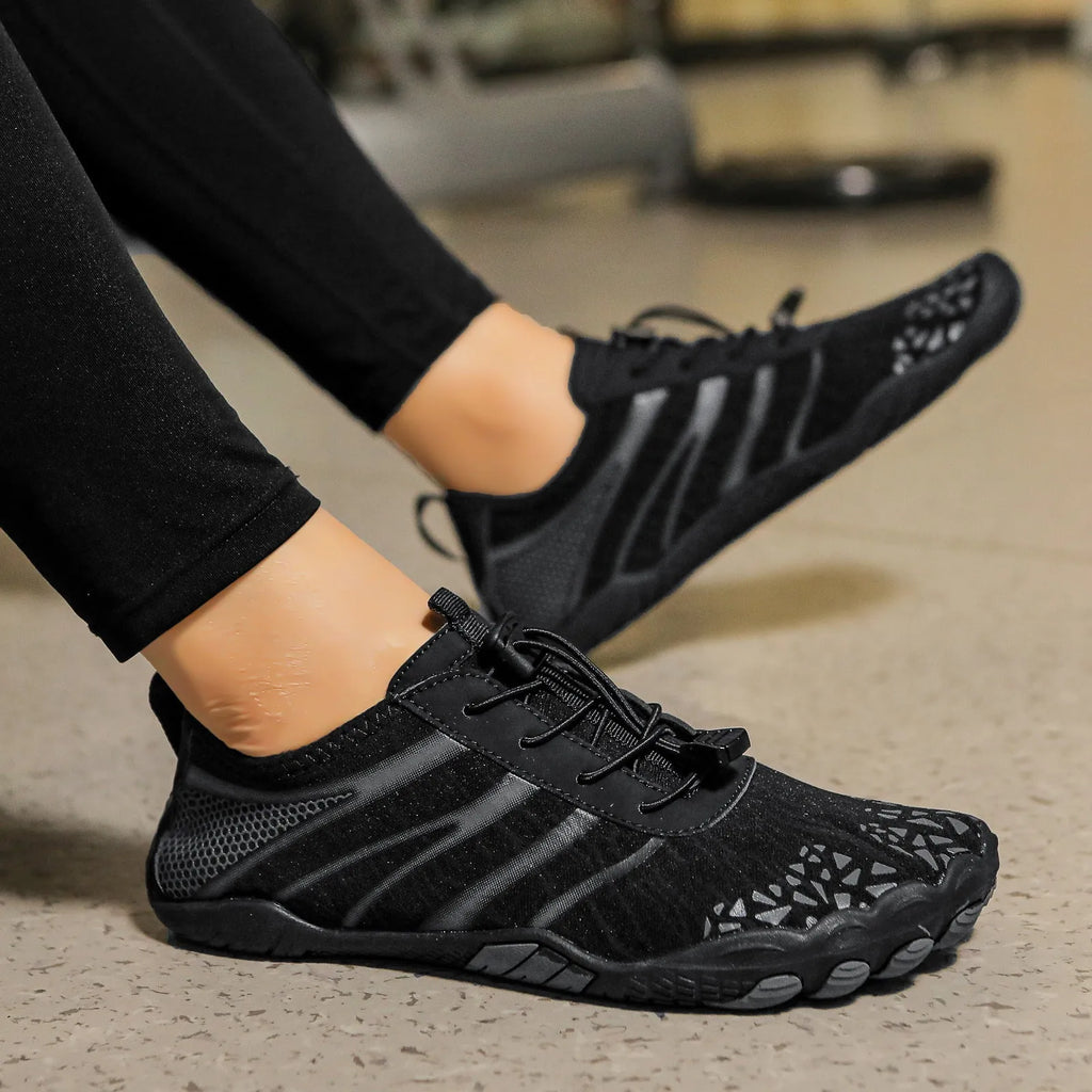 Lycra stretch fabric casual running shoes for men and women on a beach background.