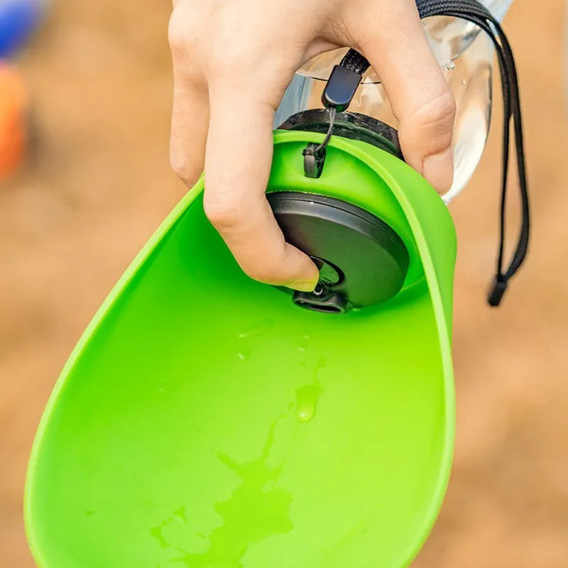 Blue portable pet water bottle with drinking bowl showing water lock mechanism and hanging attachment