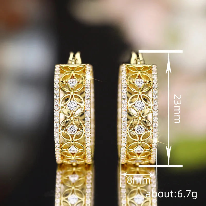 Pair of yellow gold coloured copper ear clips with a geometric horse eye flower butterfly design.
