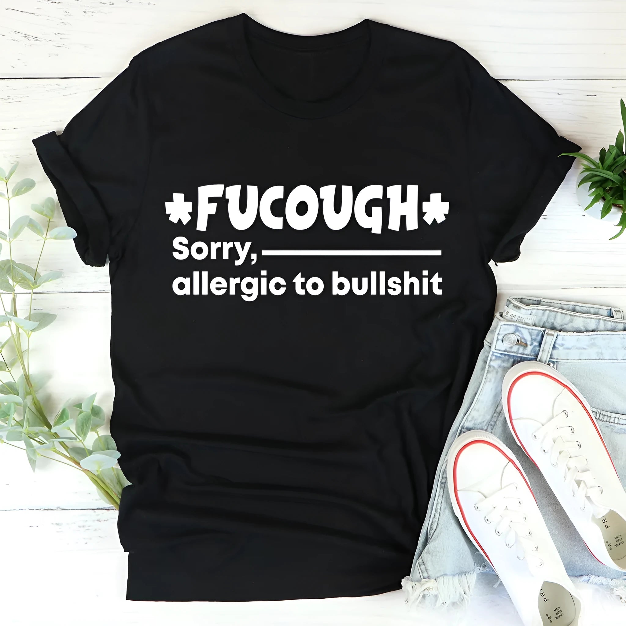 Black loose fit cotton short sleeve t-shirt with round neck on a hanger