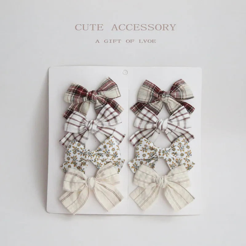 Children's eight-piece cloth bow hairclip set in dovetail shape with multiple colour options